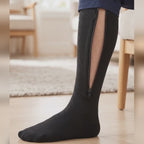 Demonstration of the Calmyo zip-up compression sock: the full-length zip closes from the ankle to just below the knee
